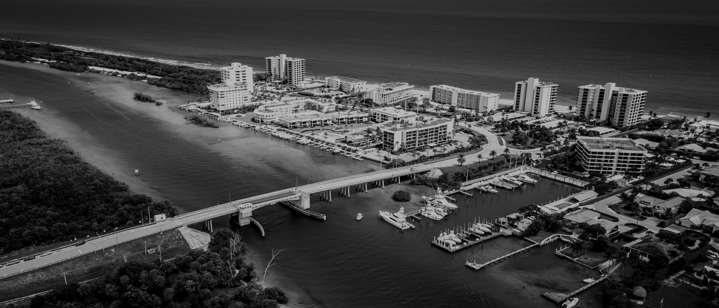 Black-and-white aerial view of the Jupiter Inlet and Atlantic coastline